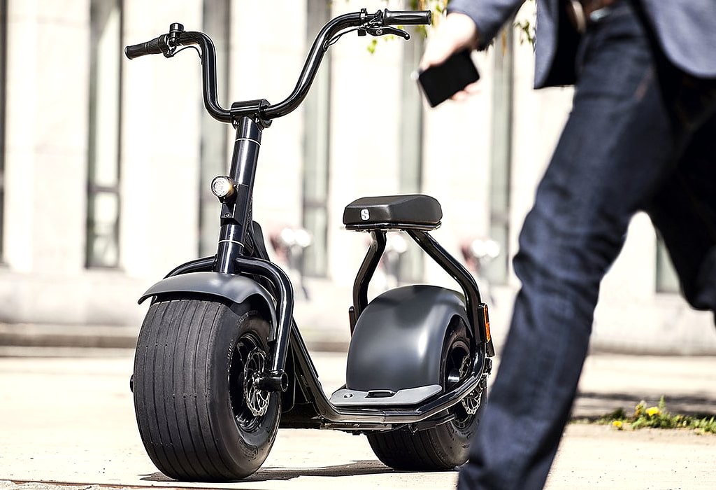 Scrooser e-scooter designed for urban mobility with a seat included